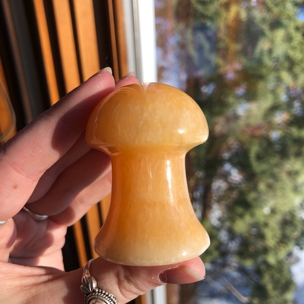 Orange calcite mushroom carving crystal